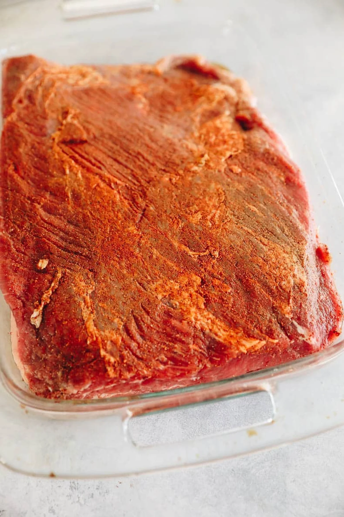 Brisket searing golden brown in a dutch oven