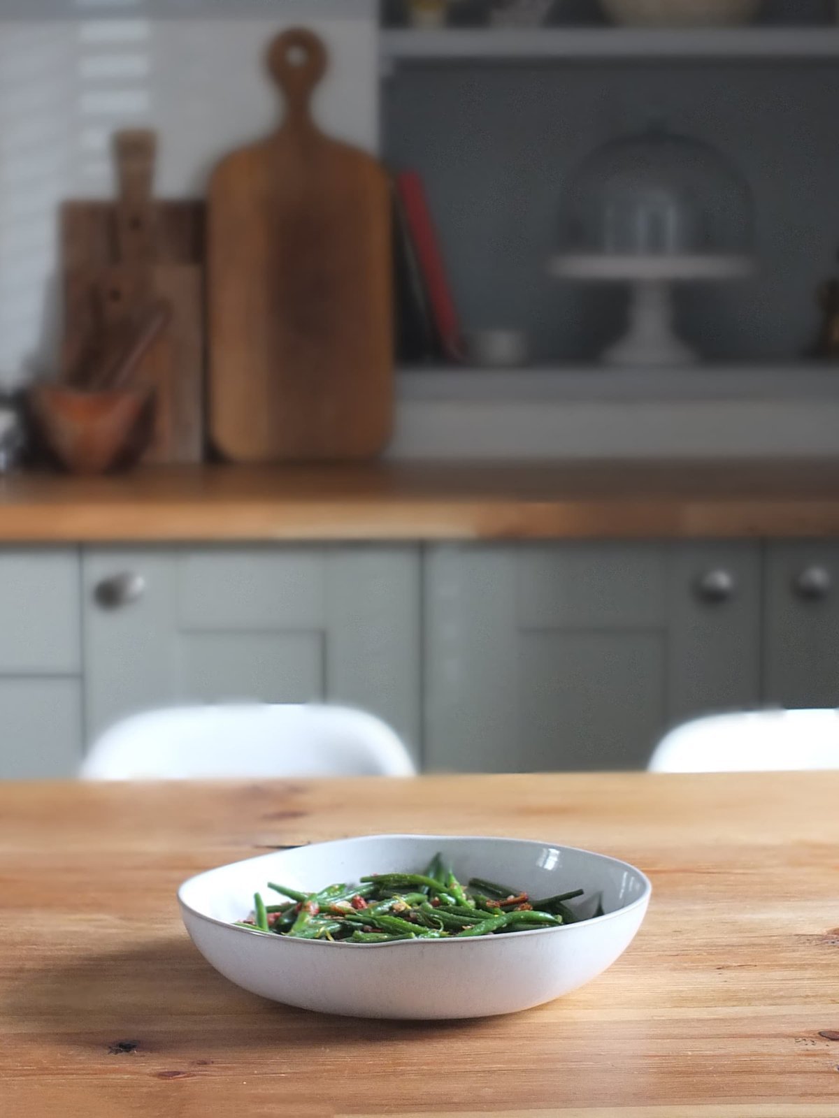 Plated green beans almondine served as a side