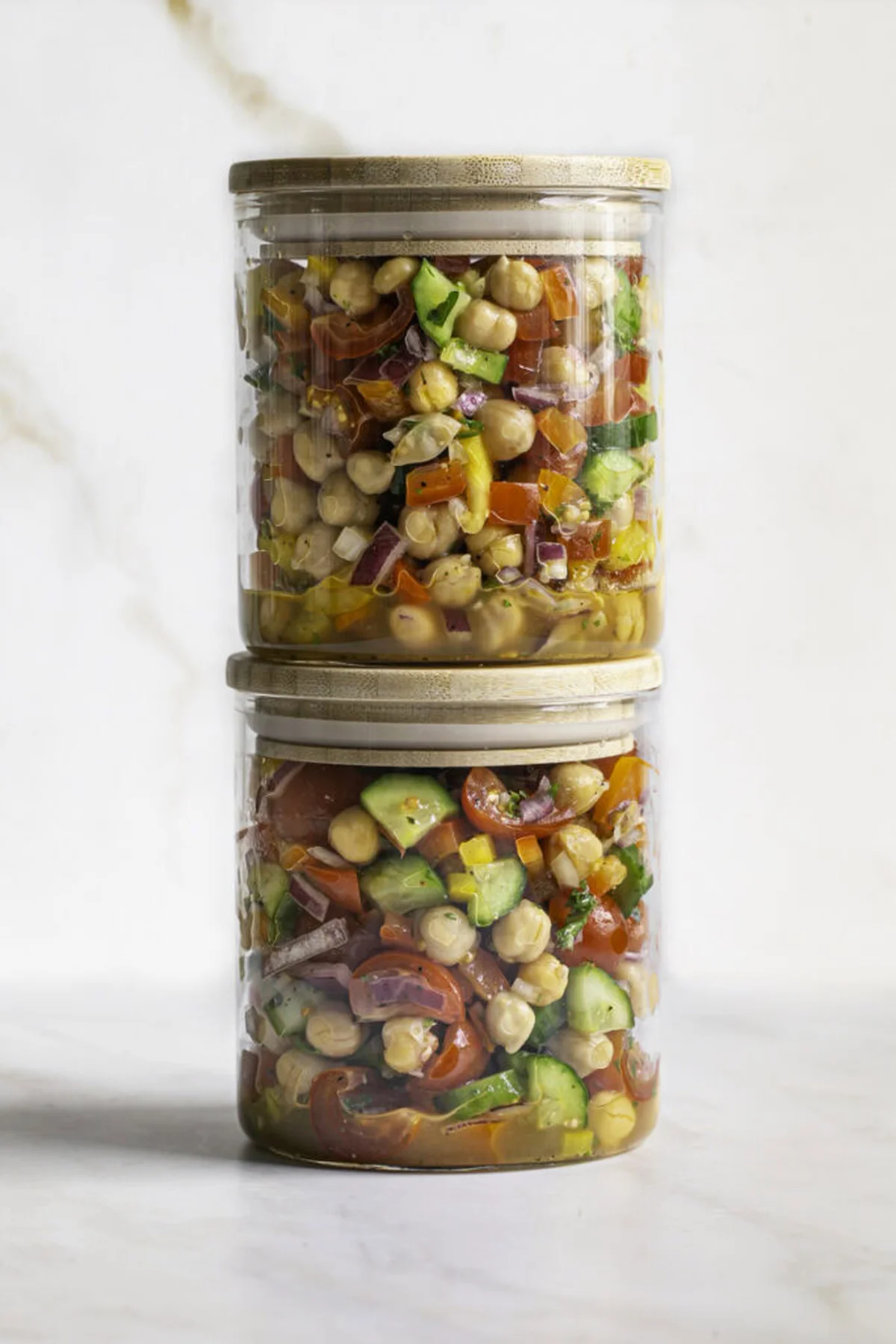 Airtight meal prep containers filled with chickpea salad