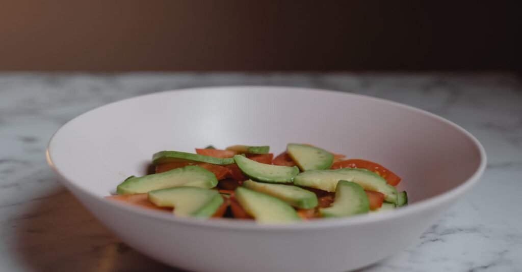 Cold avocado pasta salad with bacon, tomato, basil, and parmesan