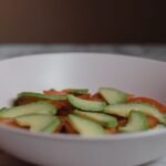 Cold avocado pasta salad with bacon, tomato, basil, and parmesan