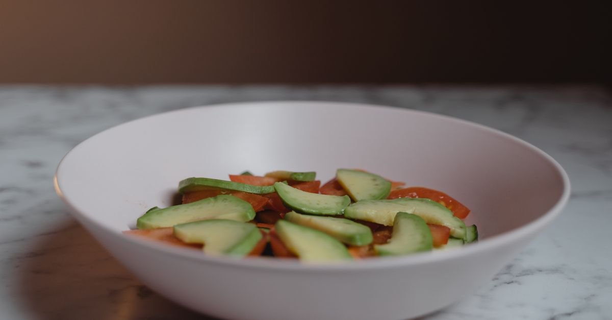 Cold avocado pasta salad with bacon, tomato, basil, and parmesan
