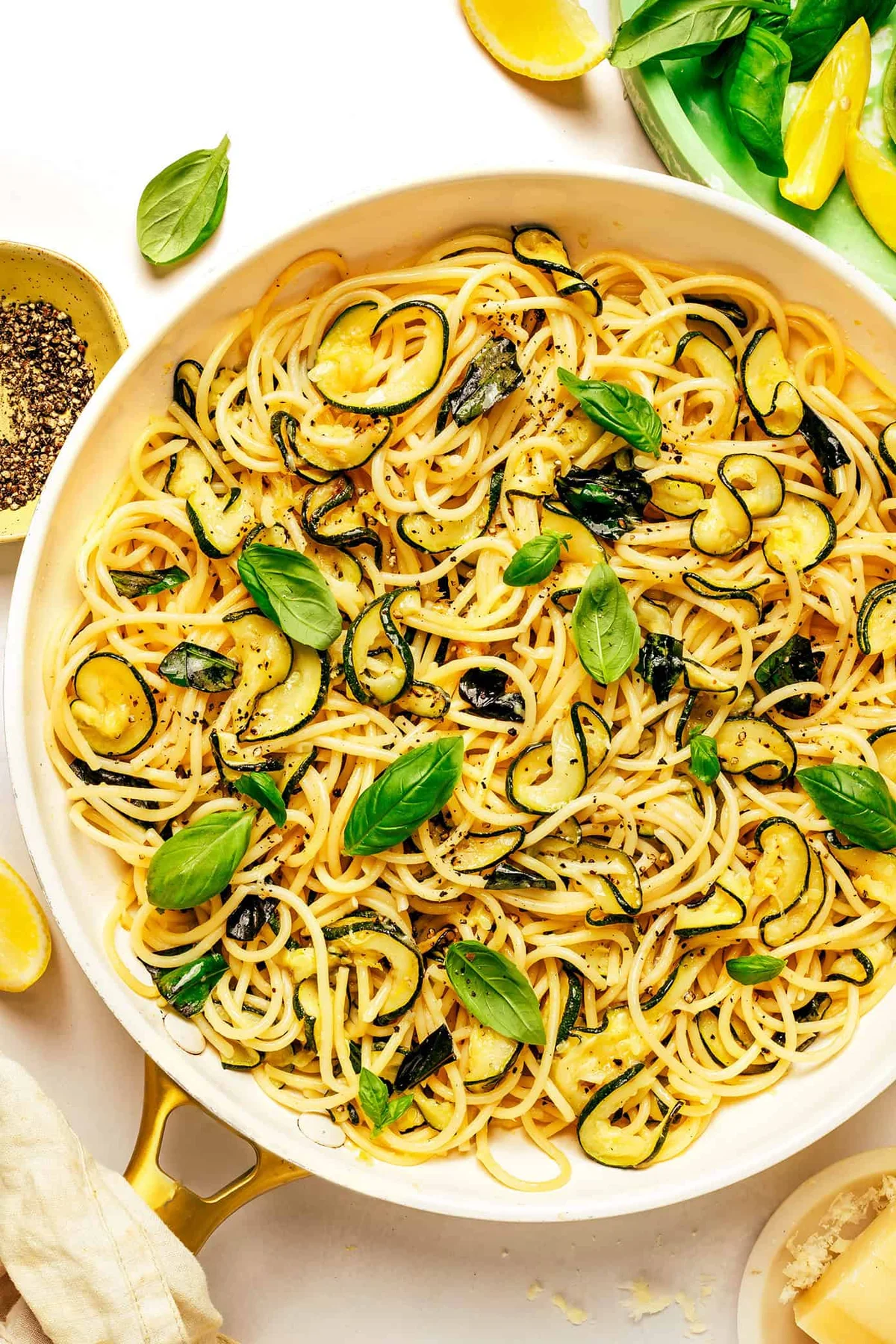 Lemony fried zucchini pasta with silky Parmesan sauce, torn basil, and lemon zest