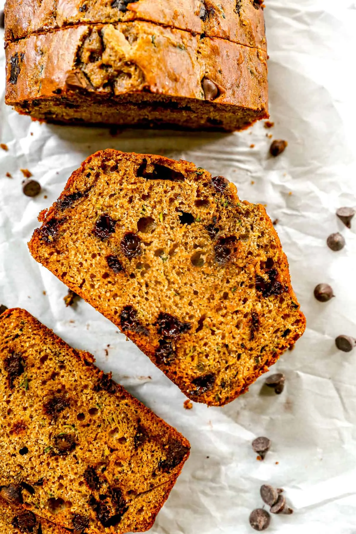 Golden chocolate chip zucchini bread loaf with melted chips