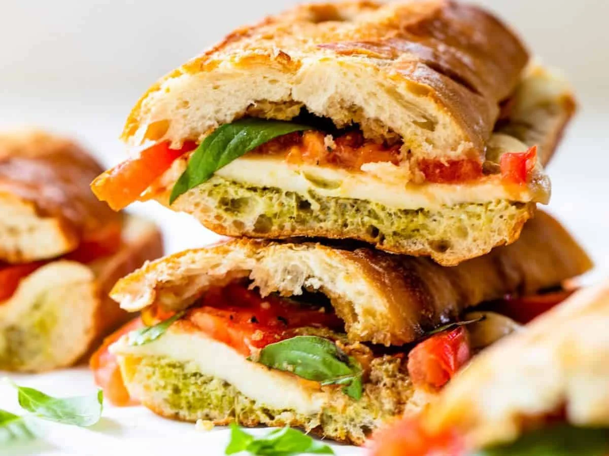 Caprese sandwich with fresh basil, tomato, and mozzarella