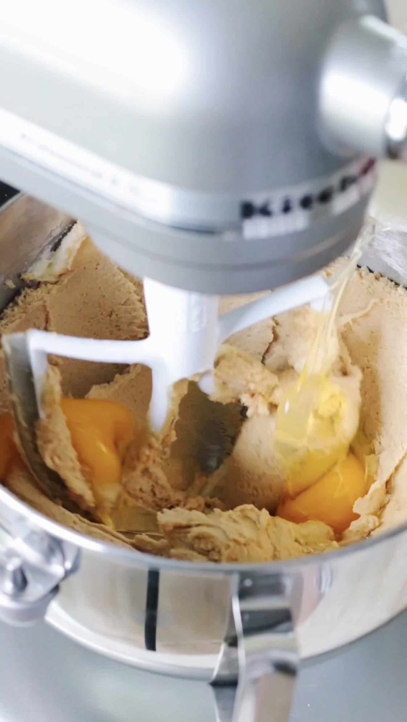 Creamed butter, egg, and brown sugar mixed in a stand mixer