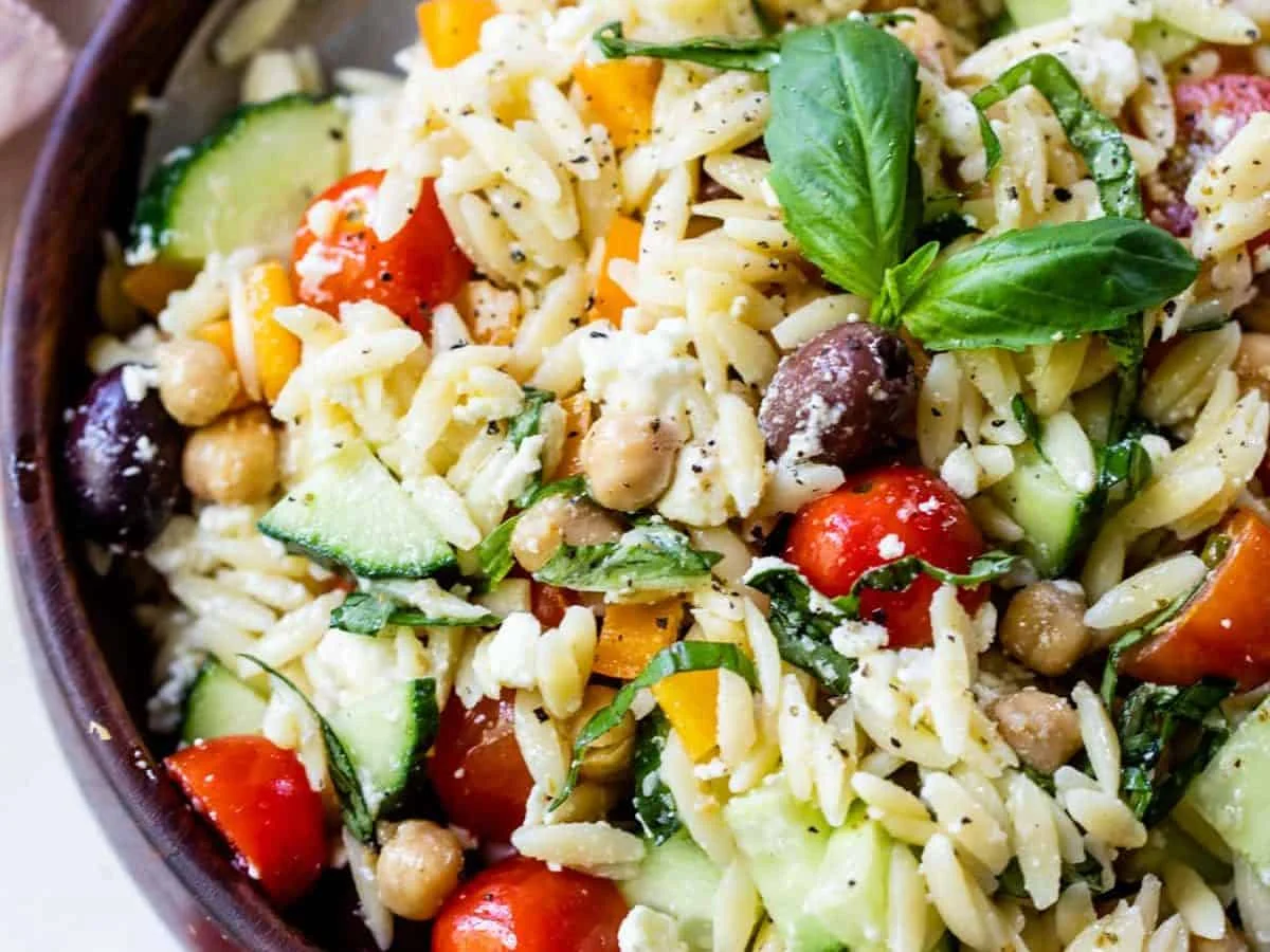 Orzo pasta salad with fresh basil and vegetables