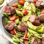 Chopped chimichurri steak salad with avocado and fresh herbs