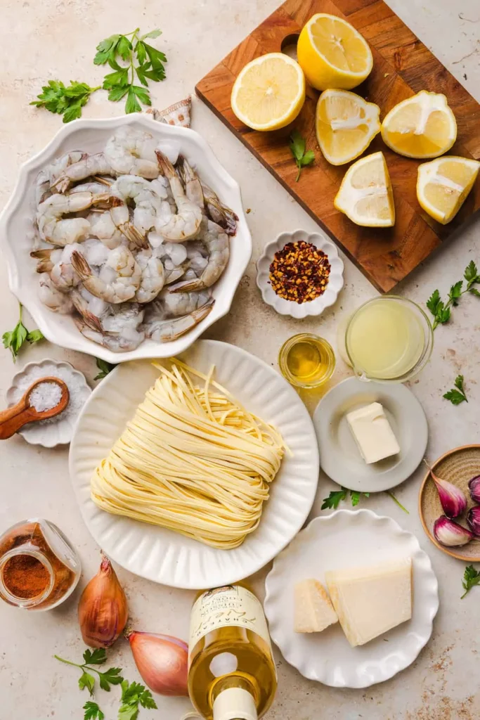 Pan of shrimp scampi with garlic lemon butter sauce over linguine