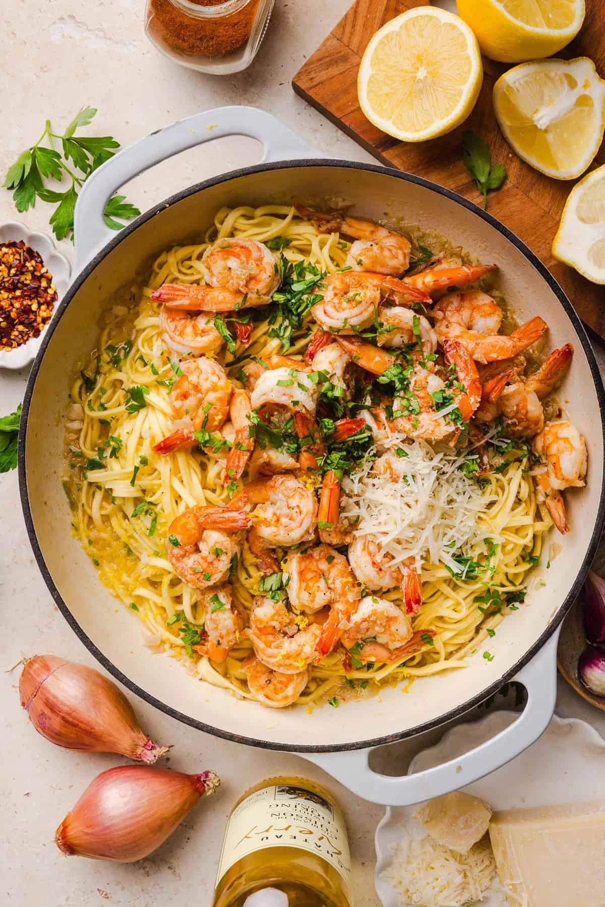 Cooking shrimp scampi sauce in a skillet with lemon and garlic